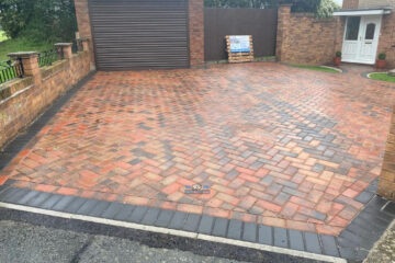 Block Paved Driveway with Charcoal Edging and Lawn in Flint