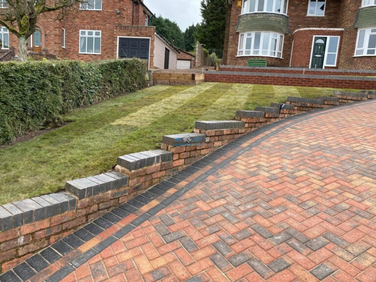 Brindle Block Paved Driveway with Charcoal Border and Retaining Walls in Holywell