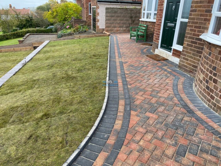 Brindle Block Paved Driveway with Charcoal Border and Retaining Walls in Holywell