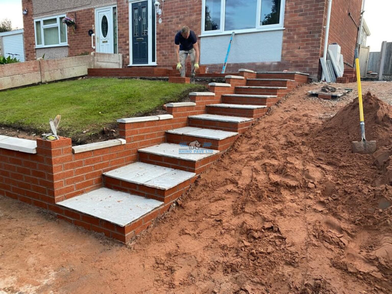 Block Paved Driveway with Retaining Wall and Indian Sandstone Steps in Holywell