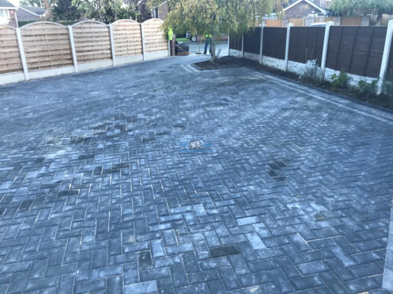 Charcoal Block Paved Driveway with Flowerbeds in Penyffordd, Flintshire