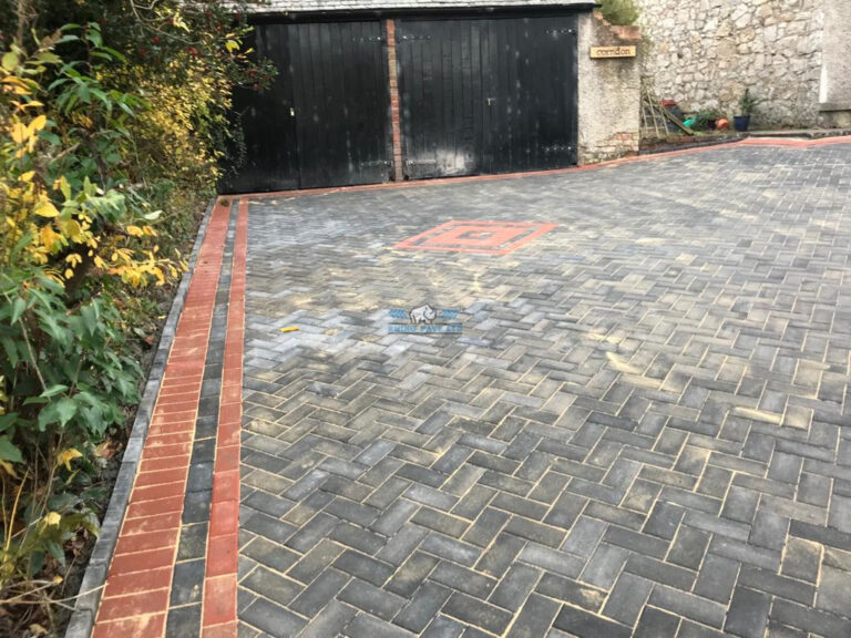 Charcoal Paved Driveway with Terracotta Borders and Patterns in Holywell, Flintshire