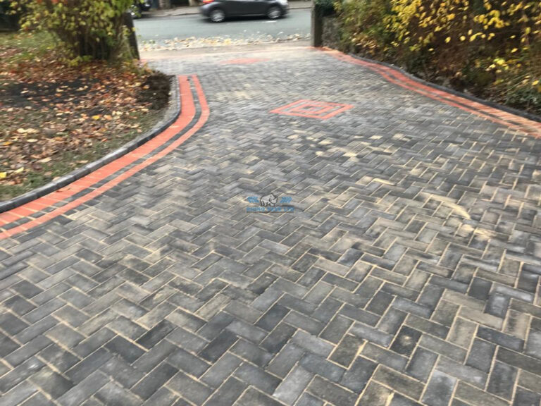 Charcoal Paved Driveway with Terracotta Borders and Patterns in Holywell, Flintshire