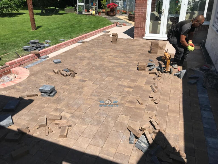 Patio with Modena Paving and Brick Retaining Wall in Flint Mountain, Flintshire