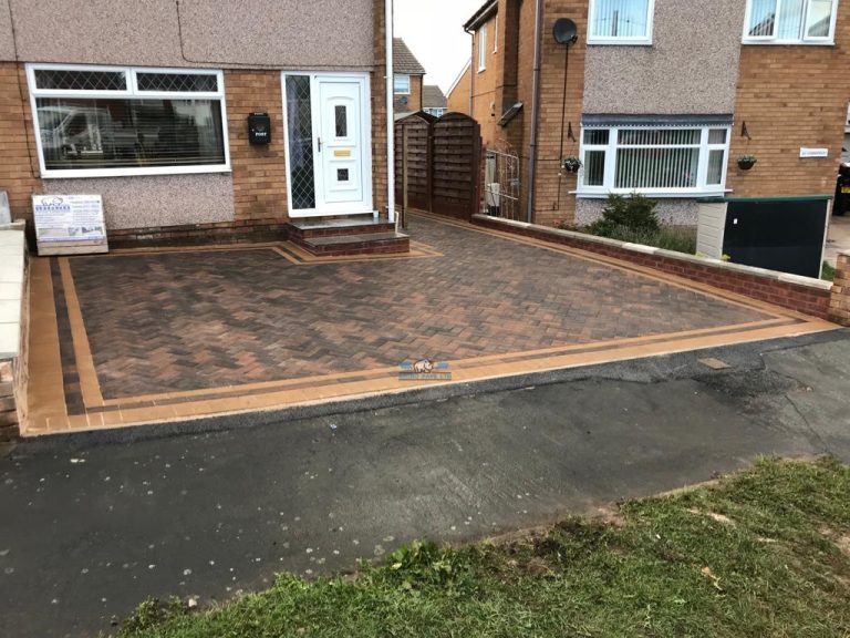 Bracken Paved Driveway with Golden Edging and Retaining Wall in Flint, Flintshire